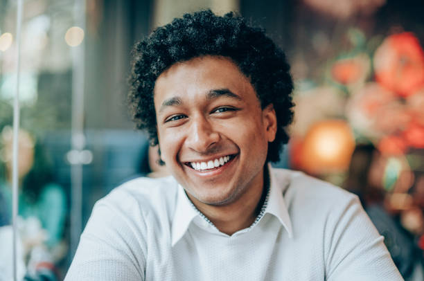 istock Happy afro-american man at cafe 1162825306