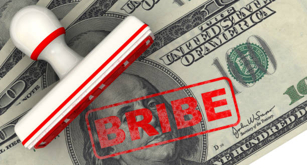 istock Bribe. Seal and imprint on the US dollar banknote 1162827867