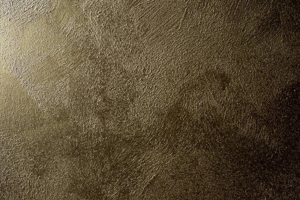 istock Grunge concrete wall texture gold brown shiny color retro design 1162830066
