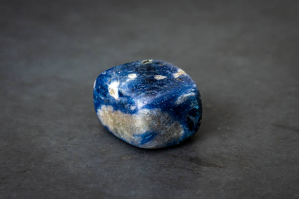 Sodalite gemstone different tones of blue white and black stock photo