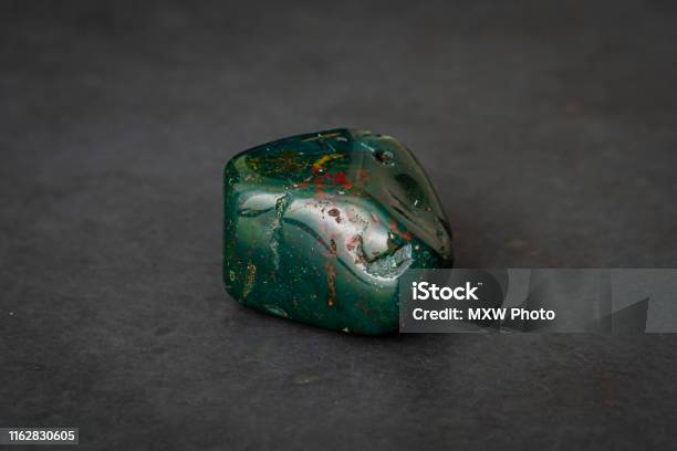 Indian Achat Deep Green Gemstone With Red And Yellow Structures All Over It Stock Photo - Download Image Now