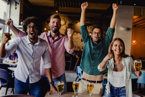 istock friends are watching a sports 1162831646