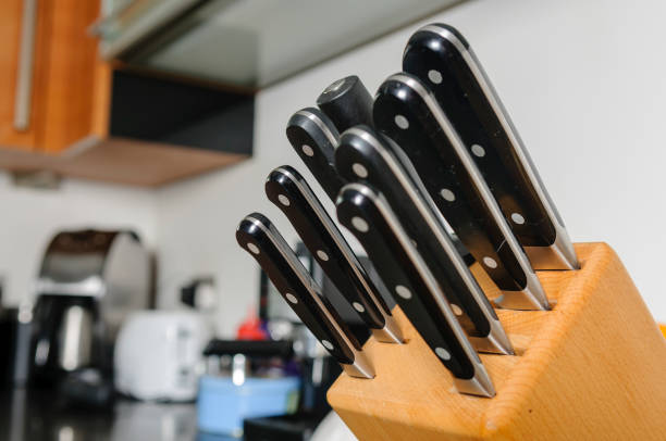 istock Set of quality Sabatier cooks knives in a modern kitchen 1162834514