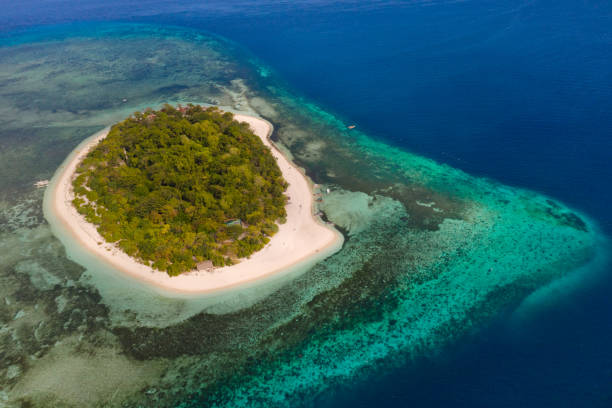 istock Mantigue Island, Philippines.Small round island with a white sandy beach 1162837136