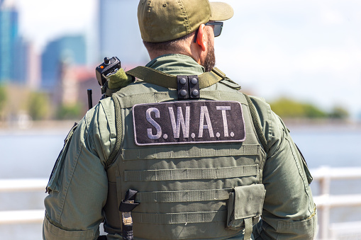 equipped swat soldier standing on a pier in New York