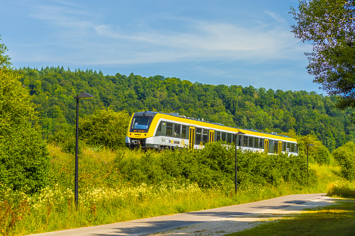 Heidenheim, Germany - July 17, 2019: Alstom Coradia Lint 54 articulated diesel railcar of SWEG AG (Southwest German Transport Company) near Heidenheim an der Brenz, Baden-Württemberg, Germany.