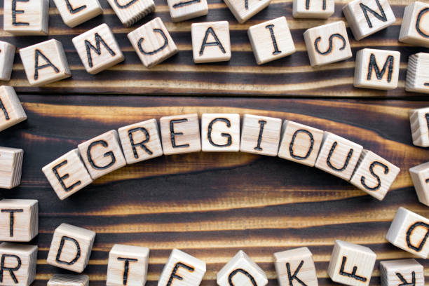 istock egregious wooden cubes with letters 1162841395