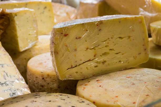 istock Different types of cheese composition on the shop window 1162843617