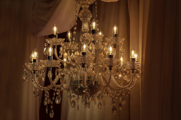 istock Beautiful electric chandelier on a dark background 1162843804
