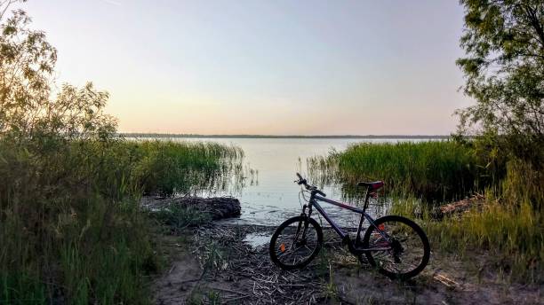 istock Bicycle near the lake and sunset 1162845986
