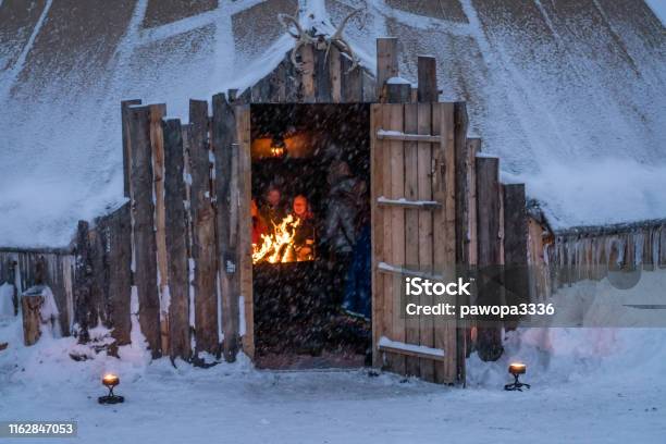 People Warming Up By The Fire Stock Photo - Download Image Now - Sami People, Norway, Tromso