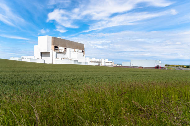 istock Nuclear power station under blue sky with clouds 1162849411