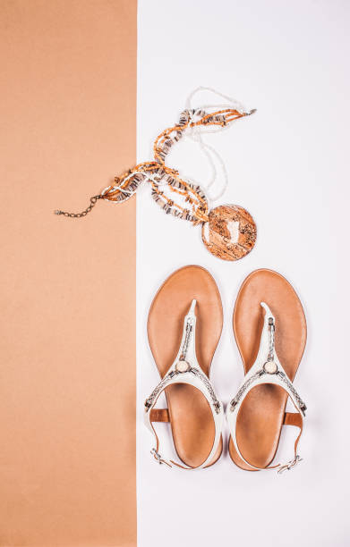 istock Summertime Vacation Accessories with Fashionable White Flat Sandals 1162853156