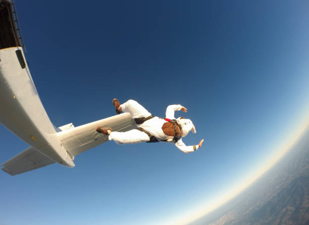 istock Happy easter bunny skydiver costume jumping free falling 1162853683