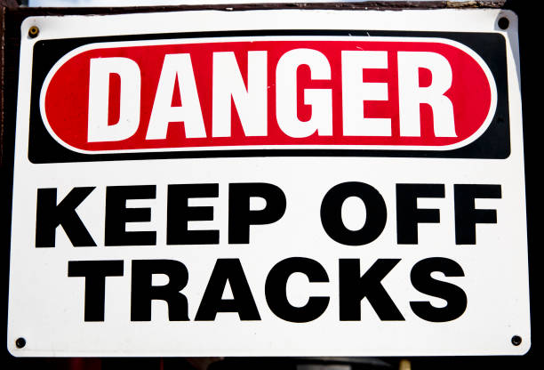istock Grungy Sign -- DANGER, Keep Off Tracks 1162854305