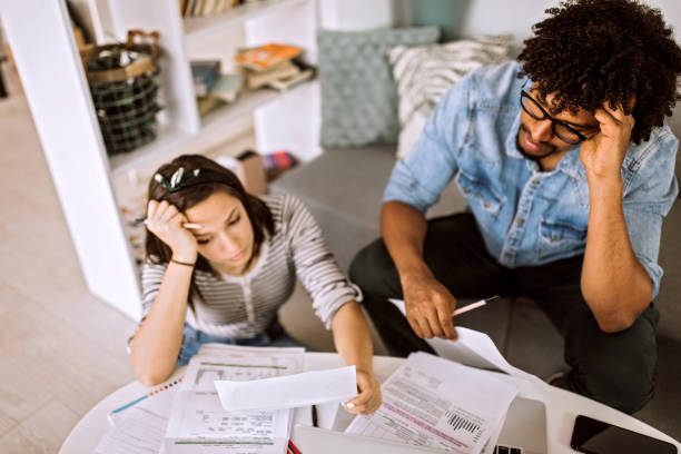 istock Couple planning budget over laptop at home 1162856618