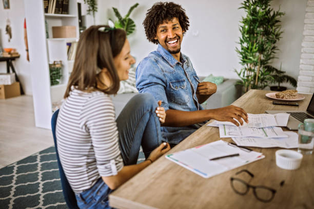 istock Young couple calculating monthly expenses at home 1162856664