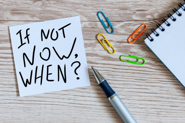 istock If Not Now When, motivational note left on the table. Motivating and inspiring question 1162856783