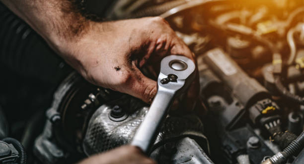 istock Auto mechanic working on car engine in mechanics garage. Repair service. authentic close-up shot 1162856879