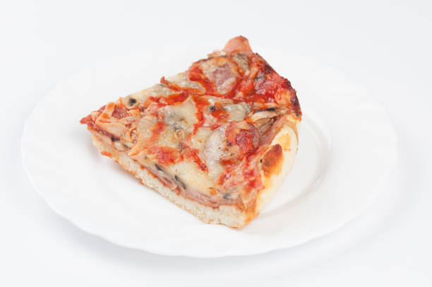 Pizza with chorizo ​​sausage, mozzarella cheese, and black olives. Rustic wooden background. Soft focus.