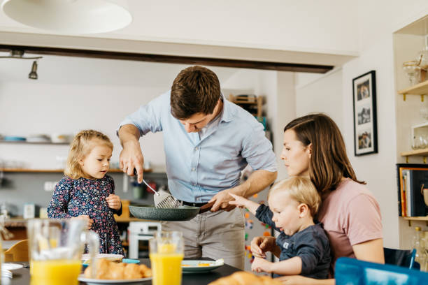 istock Father serving breakfast to family 1162863802