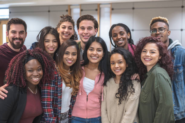 istock Multi-Ethnic Group of University Students Sitting Inside Together 1162863917