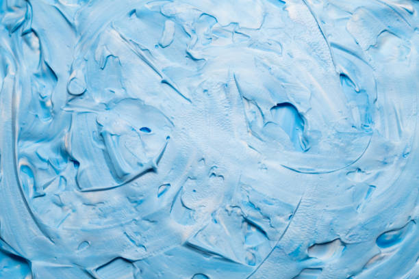 istock blue white acrylic paint background smeared foam 1162865145