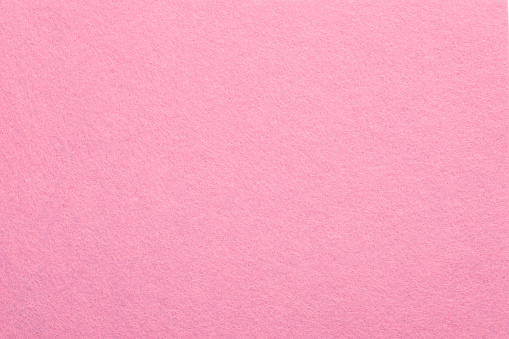 Sweet pink felt texture abstract art background. Colored fabric fibers surface. Empty space.