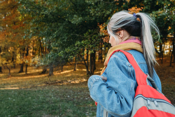 istock country tourism lady backpack autumn nature park 1162865235