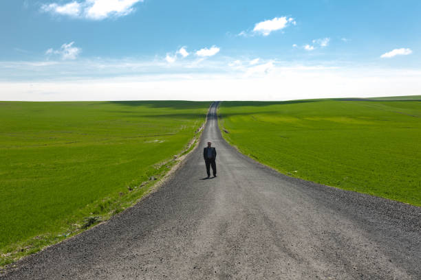 istock Man  on path in an green , Diyarbakir,Turkey 1162865665