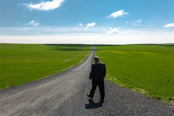istock Man  on path in an green , Diyarbakir,Turkey 1162865676