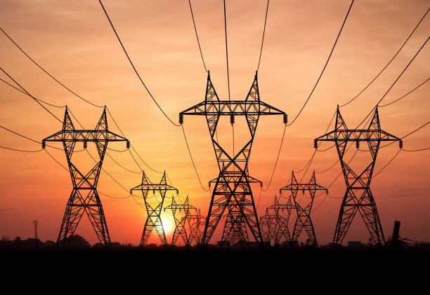 Power lines Electricity Pylons at sunset on background communication tower stock pictures, royalty-free photos & images