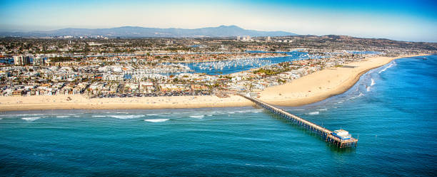 Aerial Panorama of Newport Beach California The northern Orange County California city of Newport Beach shot from an altitude of about 1500 feet over the Pacific Ocean. helicopter point of view photos stock pictures, royalty-free photos & images