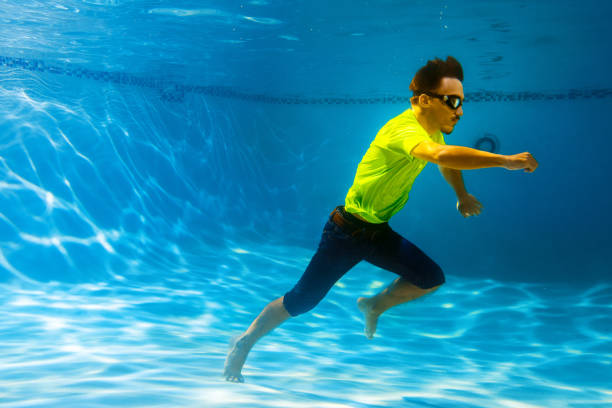 istock Teen underwater running 1162874344