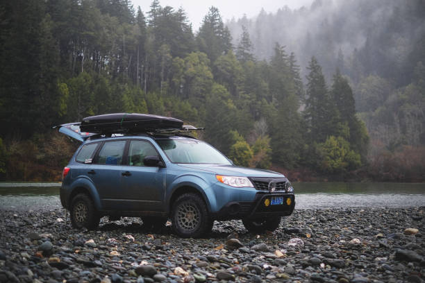 March 6, 2019 - Agness, Oregon, USA: A Subaru Forester modified for offroad use on a gravel bar of the Rogue River in southwest Oregon