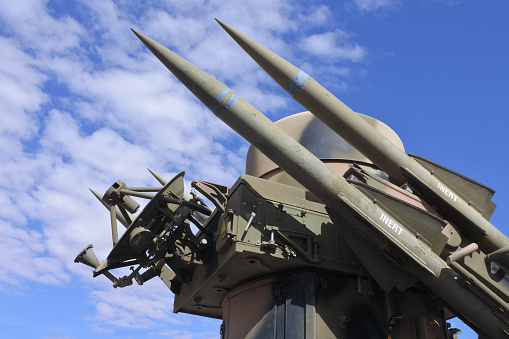 Surface-to-air missiles with radar guidance system pointing to the sky.