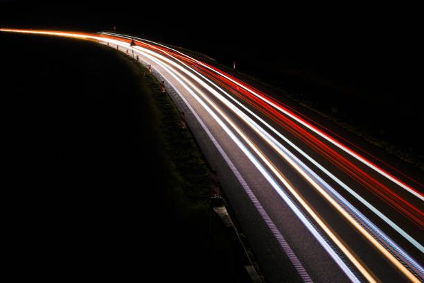 istock lights of cars with night 1162887568