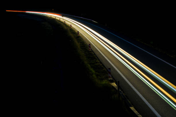 istock lights of cars with night 1162887694