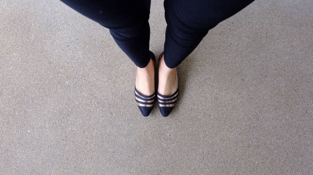 istock Low heel shoe on cement background, Top view. 1162889077