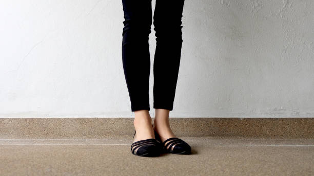 istock Low heel shoe on cement background, Top view. 1162889088