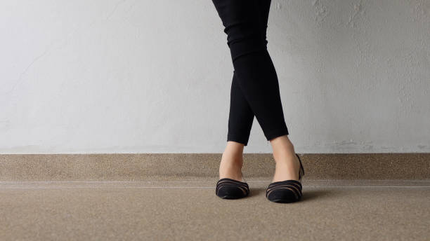 istock Low heel shoe on cement background, Top view. 1162889089