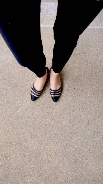 istock Low heel shoe on cement background, Top view. 1162889094