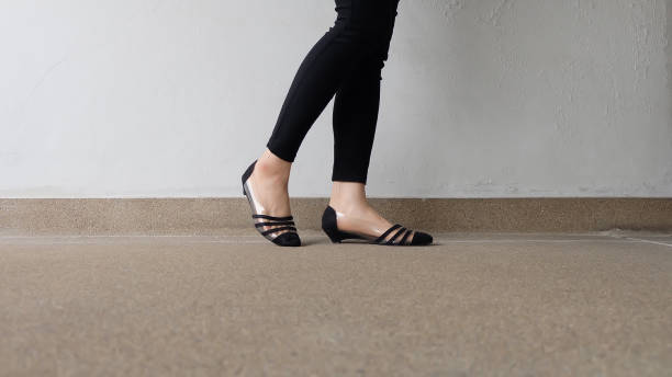 istock Low heel shoe on cement background, Top view. 1162889103