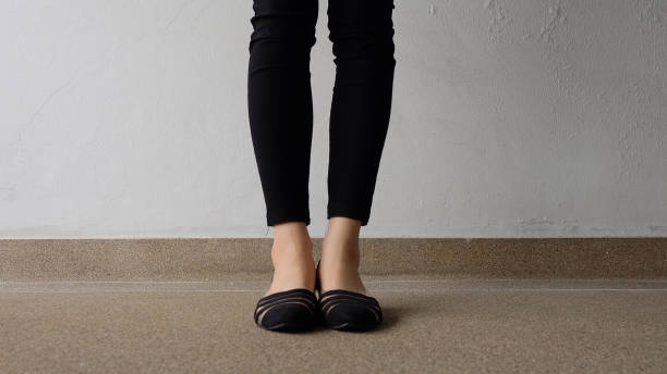 istock Low heel shoe on cement background, Top view. 1162889107