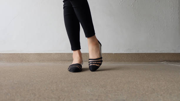 istock Low heel shoe on cement background, Top view. 1162889134