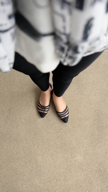istock Low heel shoe on cement background, Top view. 1162889137