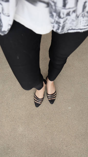 istock Low heel shoe on cement background, Top view. 1162889144