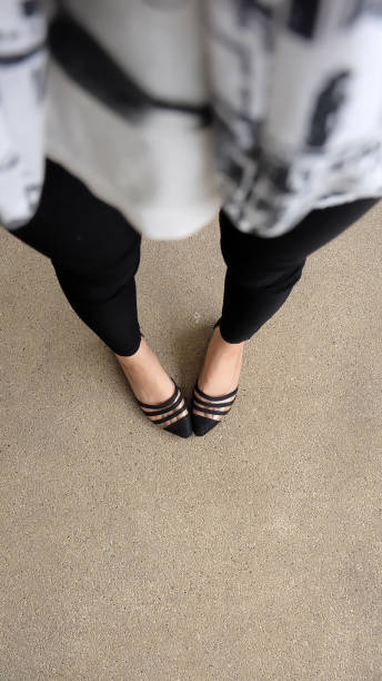 istock Low heel shoe on cement background, Top view. 1162889151