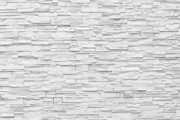 istock Surface white wall of stone wall gray tones for use as background. 1162890083
