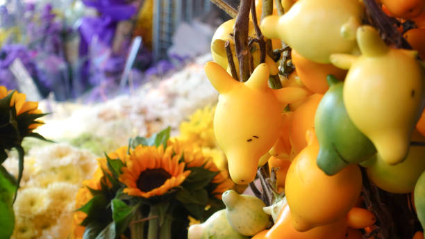Lovely yellow eggplant doll with flowers